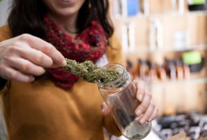 woman showing dispensary product