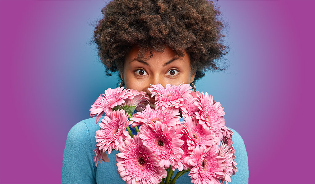 Woman smelling flowers