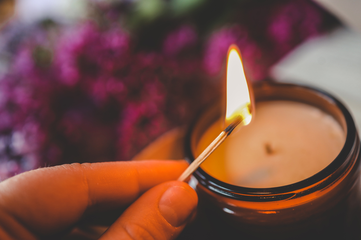 Girl lights a candle, spring aesthetics.