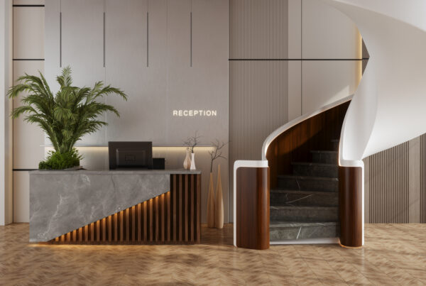 Lobby Interior With Reception Desk, Stairs And Potted Plant