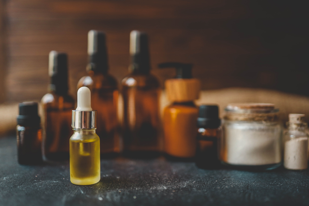 Cosmetics packaging. Set of different cosmetic bottles of cream or serum on a ceramic tray. Blank packaging. Natural beauty spa product concept. Beauty.