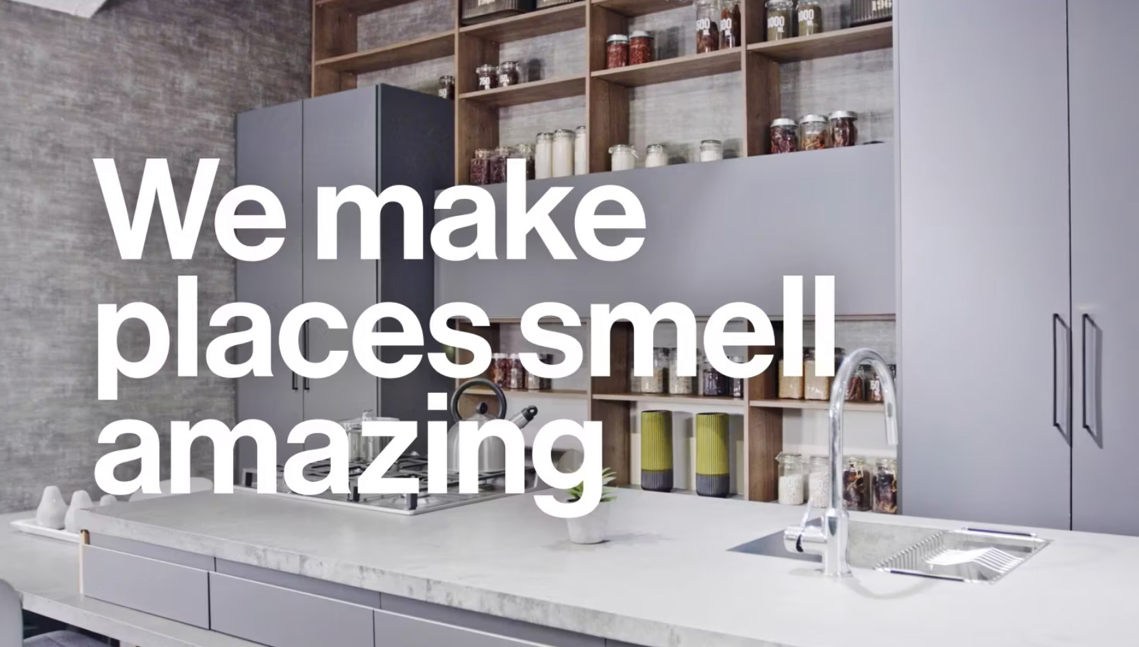 Modern Kitchen with text overlay, "We Make Places Smell Amazing"